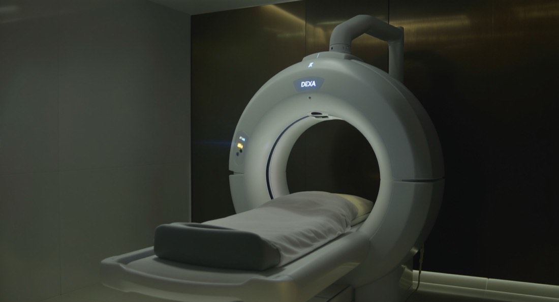 A DEXA body composition scanner in a clean clinical room